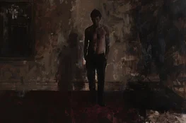 Figure solitaire dans une pièce sombre évoquant entretien avec un vampire, symbolisant la fatigue de l’immortalité et l’esthétique Memento-mori